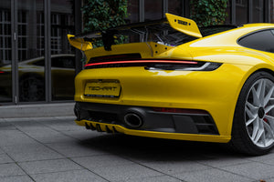 Techart Porsche 992 Carrera GTS SportDesign Diffusor-tillegg — racing yellow 3/4 perspektiv