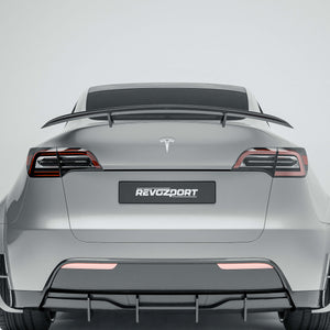 Tesla Model Y 21-24 with a carbon fiber spoiler on a white background