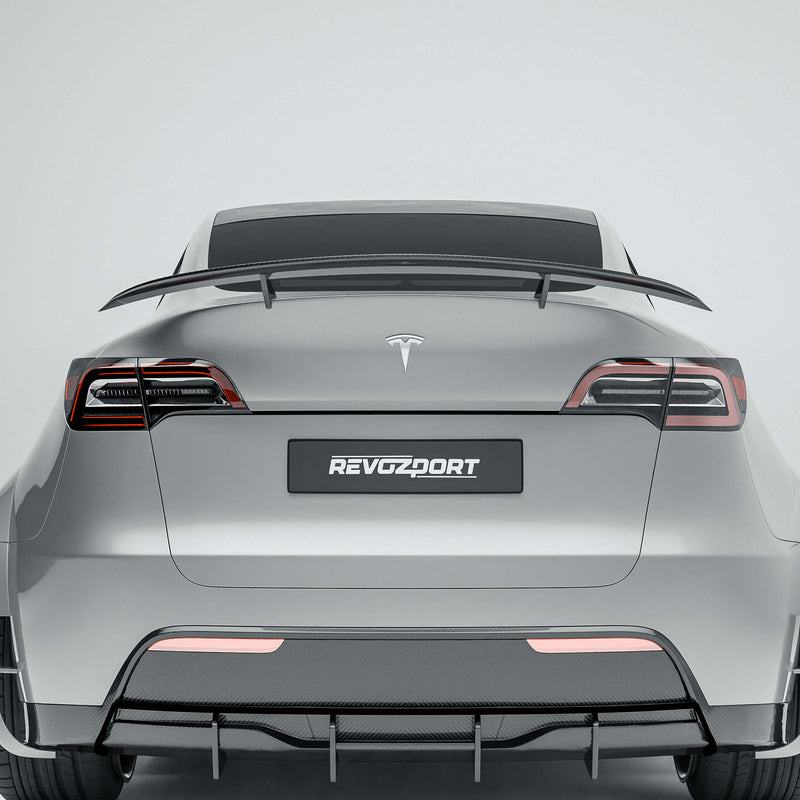 Tesla Model Y 21-24 with a carbon fiber spoiler on a white background